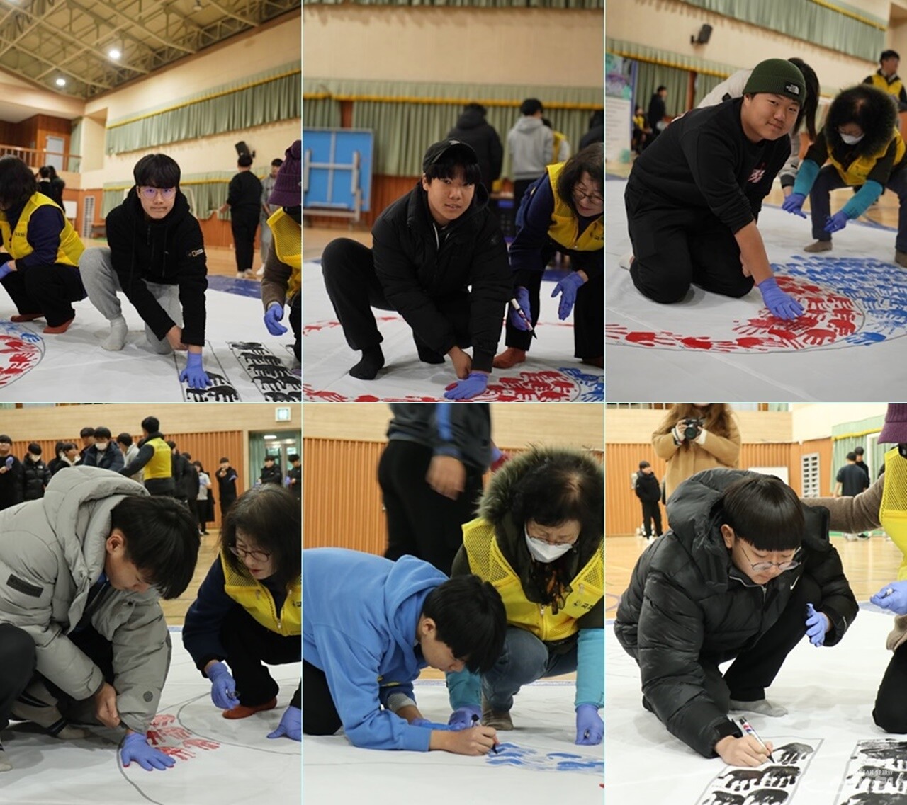 천안중학교 전교생이 참여해 태극과 건곤감리 문양을 손도장으로 완성했다. 사진 강나리, 하미진 기자.