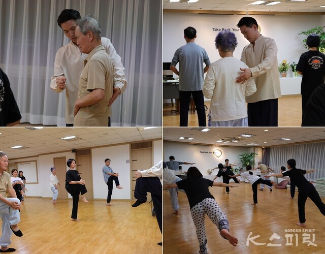 그룹코칭을 하면서도 한 사람 한 사람의 척추 자세와 호흡, 긴장과 이완을 점검하는 이재호 원장. 사진 강나리 기자.