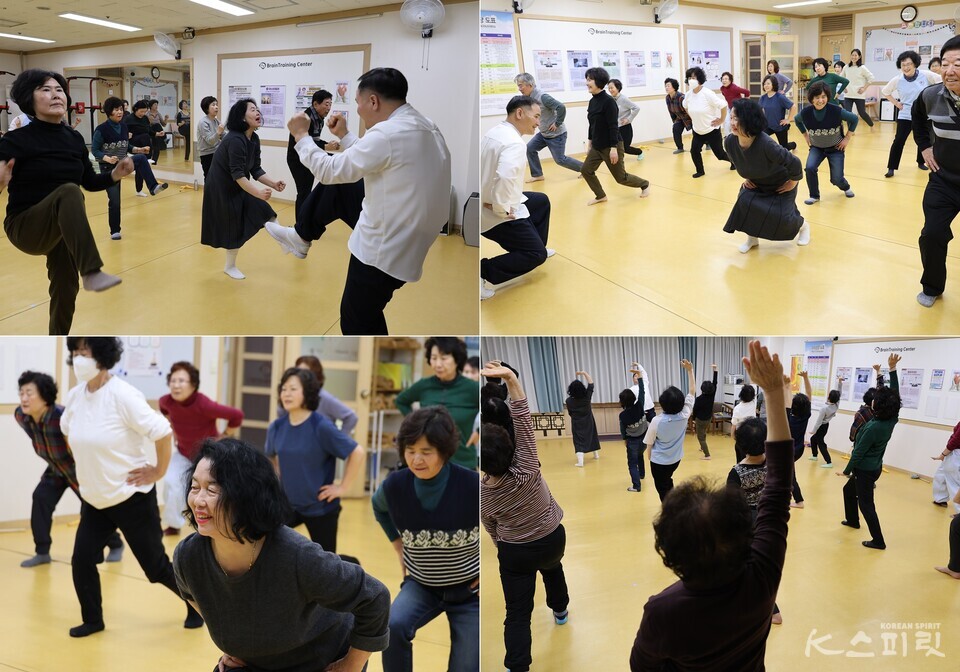 브레인비타민 명상 중 브레인체조 시간. 자신의 몸에 집중하는 진지한 가운데 웃음을 잃지 않는 참가자들. 사진 강나리 기자.